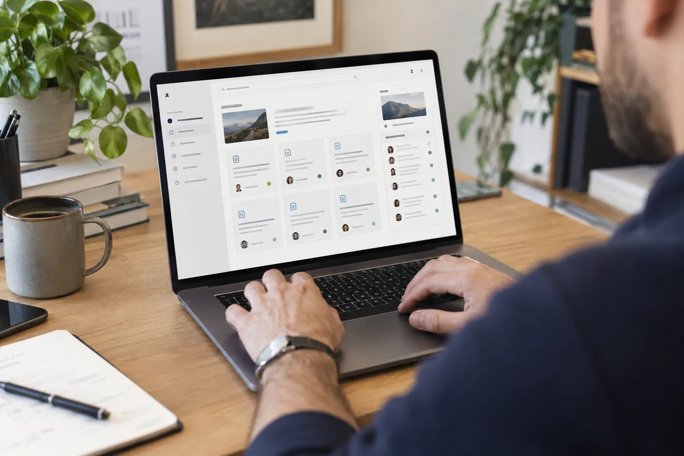 An employee reviews a source-backed internal knowledge base on a laptop.